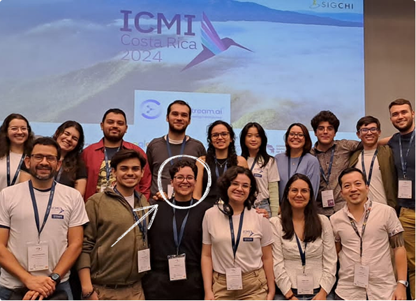A group of people at the ICMI Conference, among them Emilio, with a big smile.